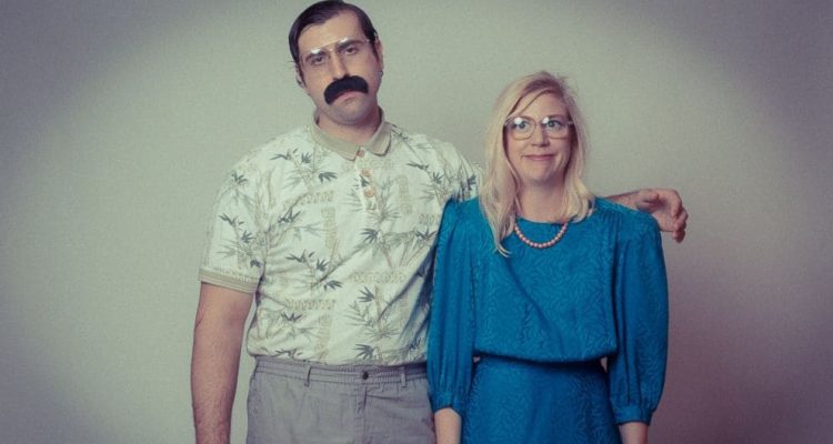 a man and a woman wearing awkward 70's clothing